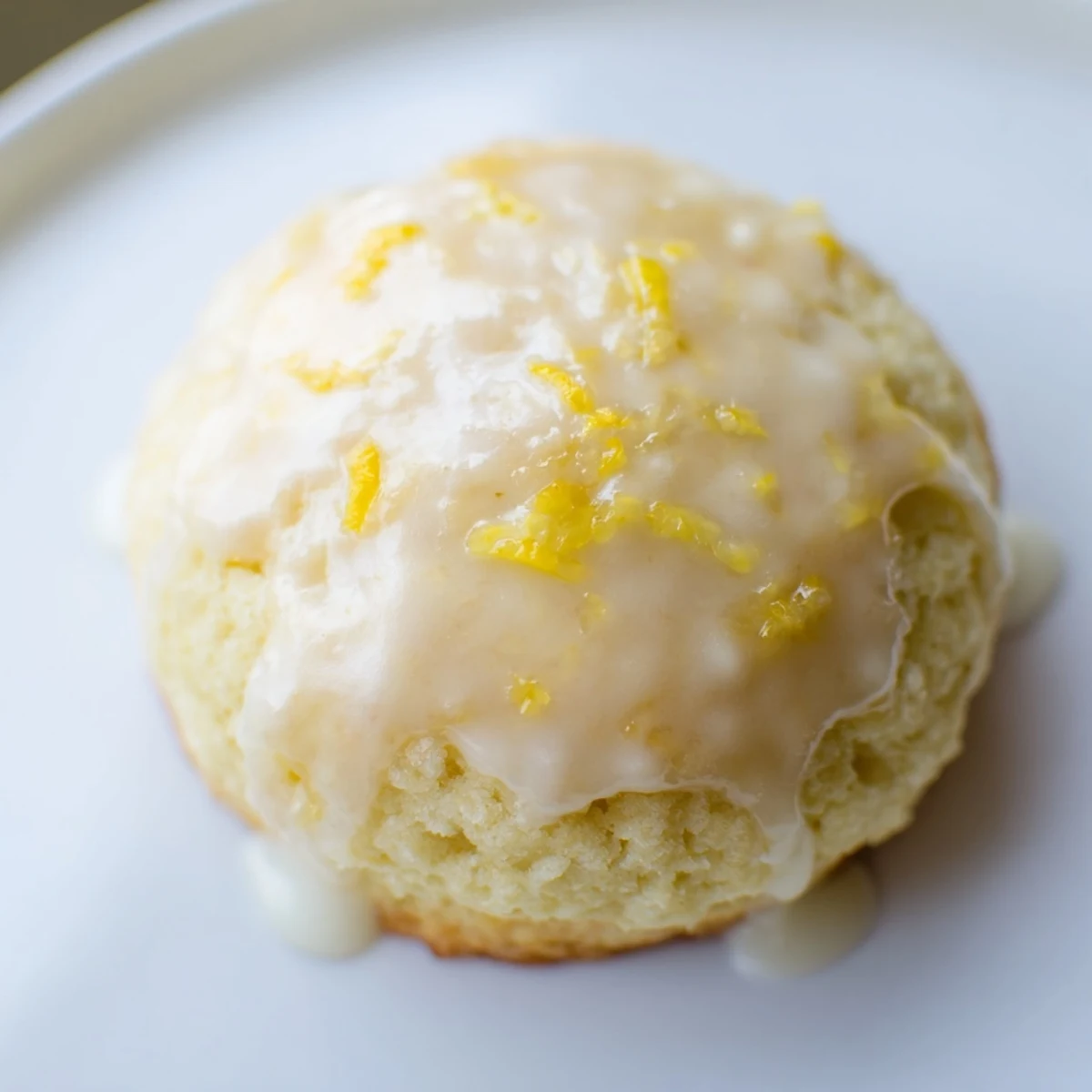 Freshly baked Lemon Ricotta Cookies with glaze drizzled over tender, cake-like rounds, perfect for a sweet-tart dessert.