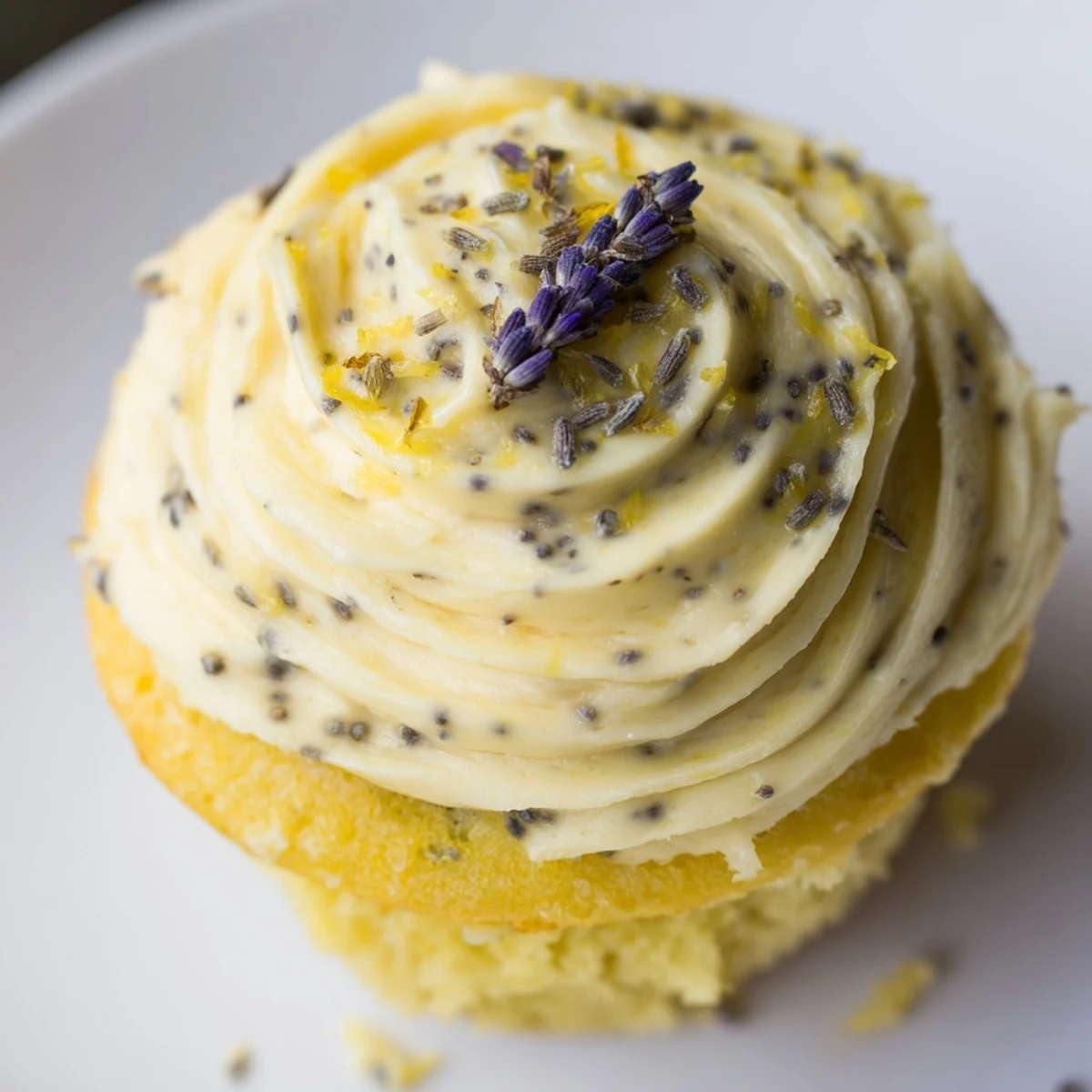Fresh lemon lavender cupcakes with fluffy buttercream frosting topped with zest