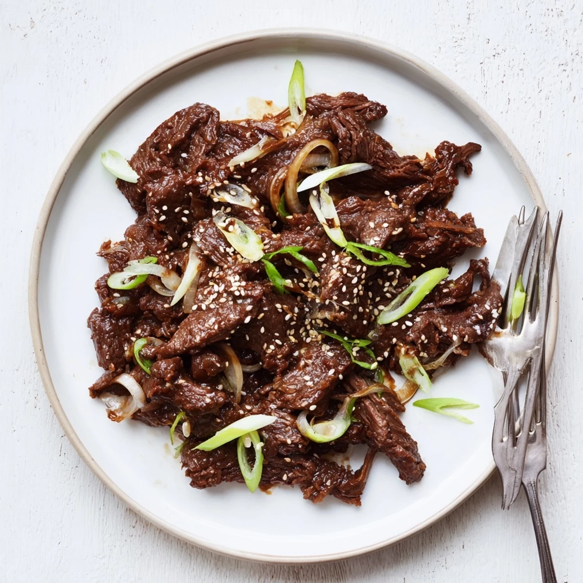 Flavorful Korean beef slow-cooked for hours until fork-tender, served over fluffy white rice