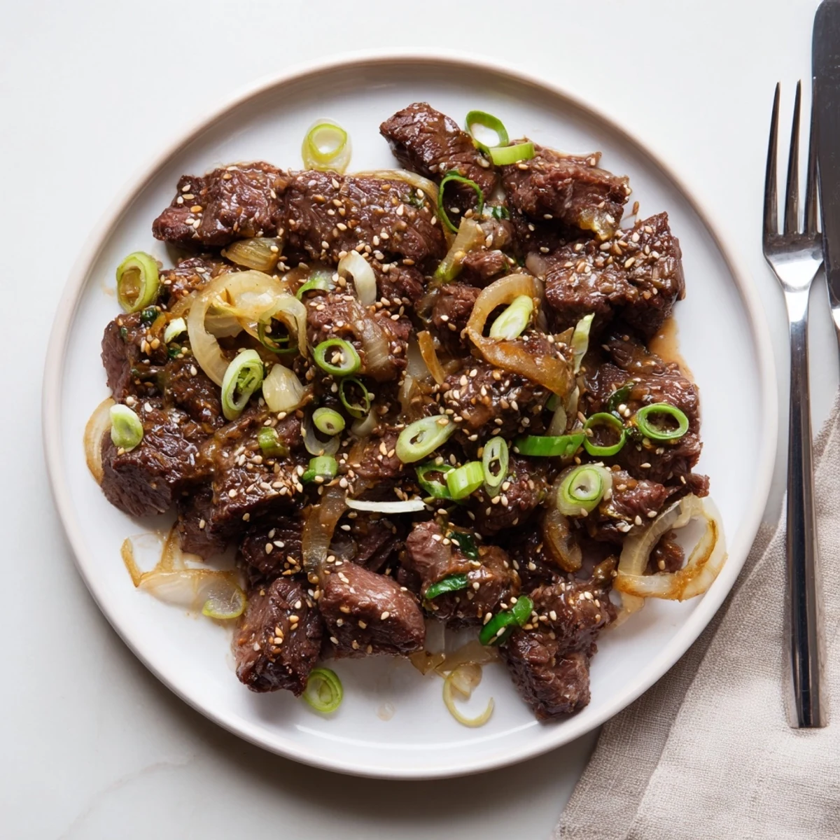 Mouthwatering slow cooker Korean beef with caramelized glaze and fresh green onion topping