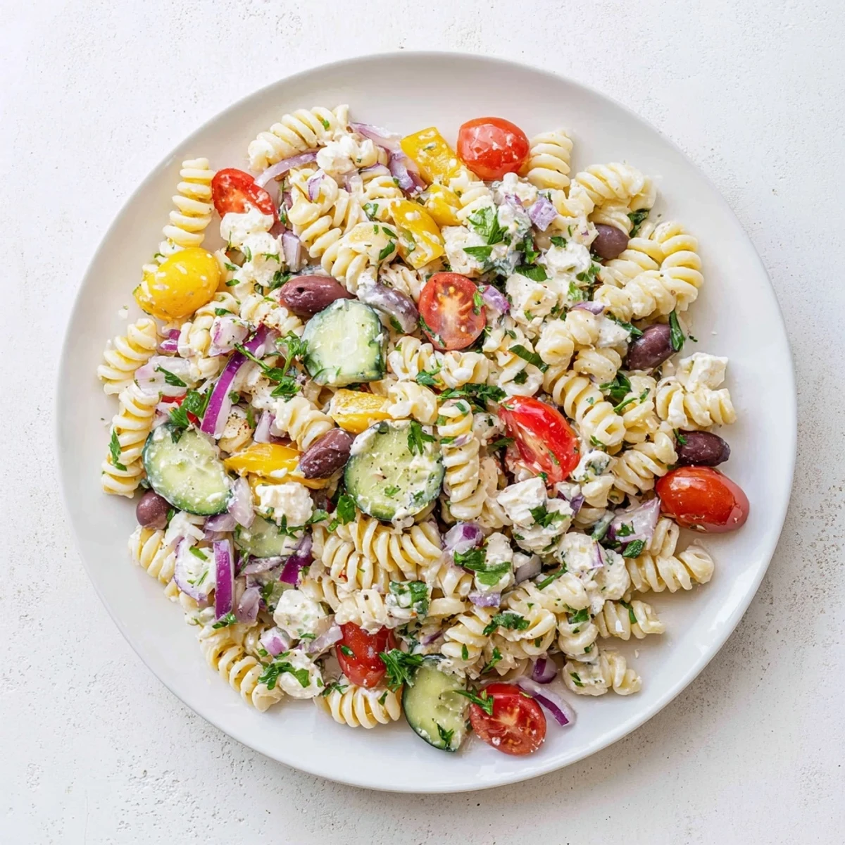 Creamy Mediterranean cottage cheese pasta salad with crisp bell peppers and parsley ready for a light lunch