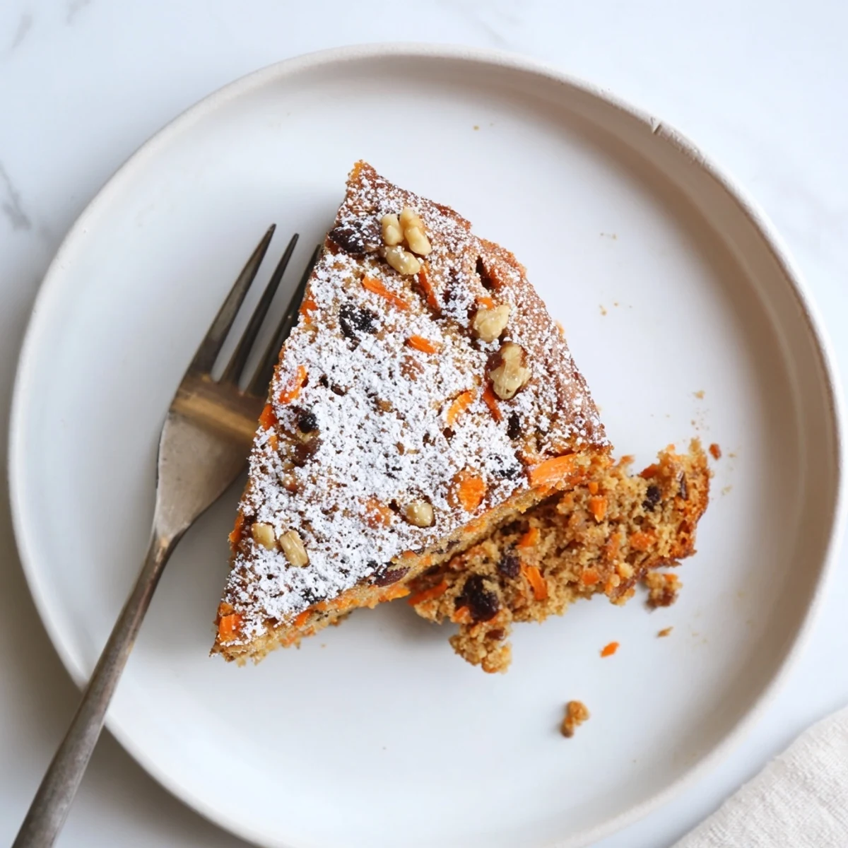 Wholesome Greek yogurt carrot cake recipe featuring a soft crumb with hints of nutmeg and vanilla.
