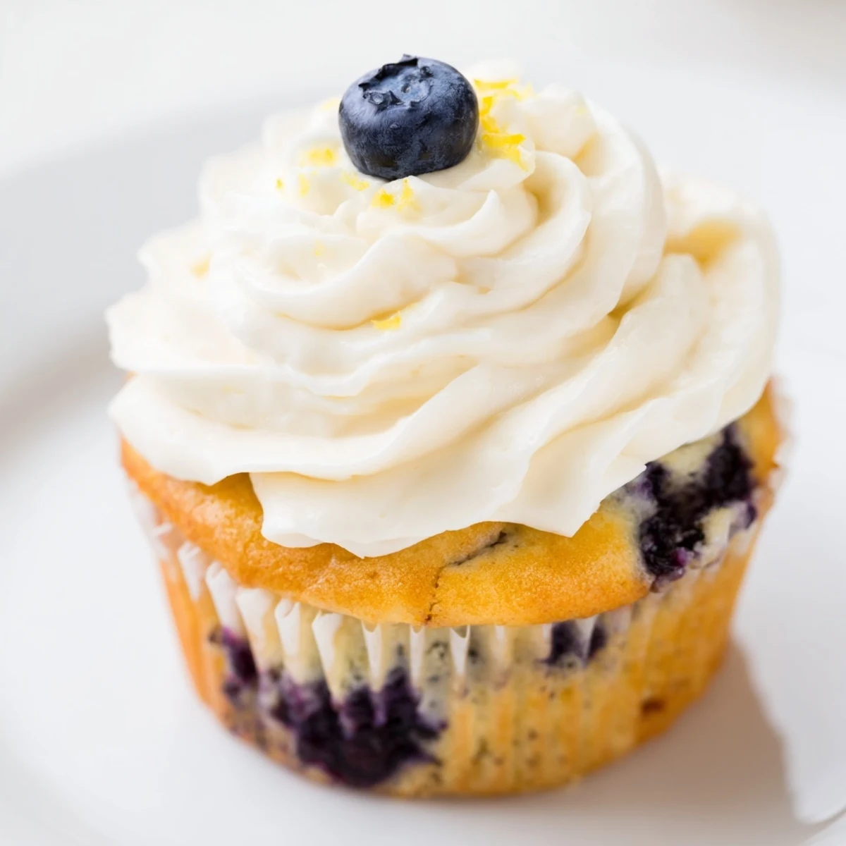 Light and airy lemon blueberry cupcakes with swirls of tangy cream cheese frosting