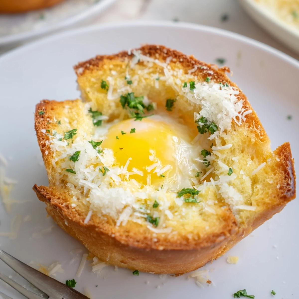 Golden-yolk Lazy Garlic Bread Egg Cups served with crisp mixed fruit