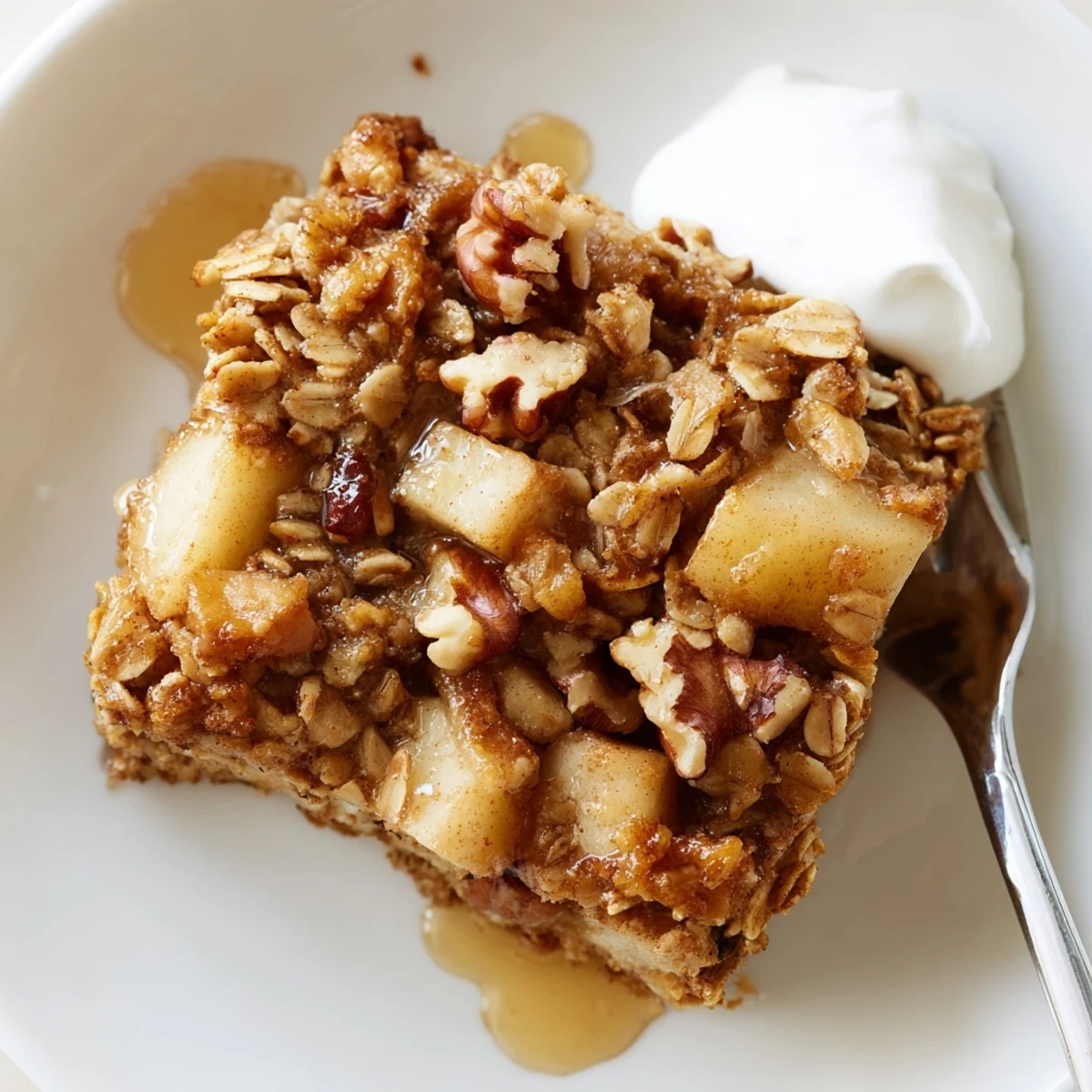 Steaming Apple Cinnamon Oatmeal Bake Recipe served warm with creamy yogurt