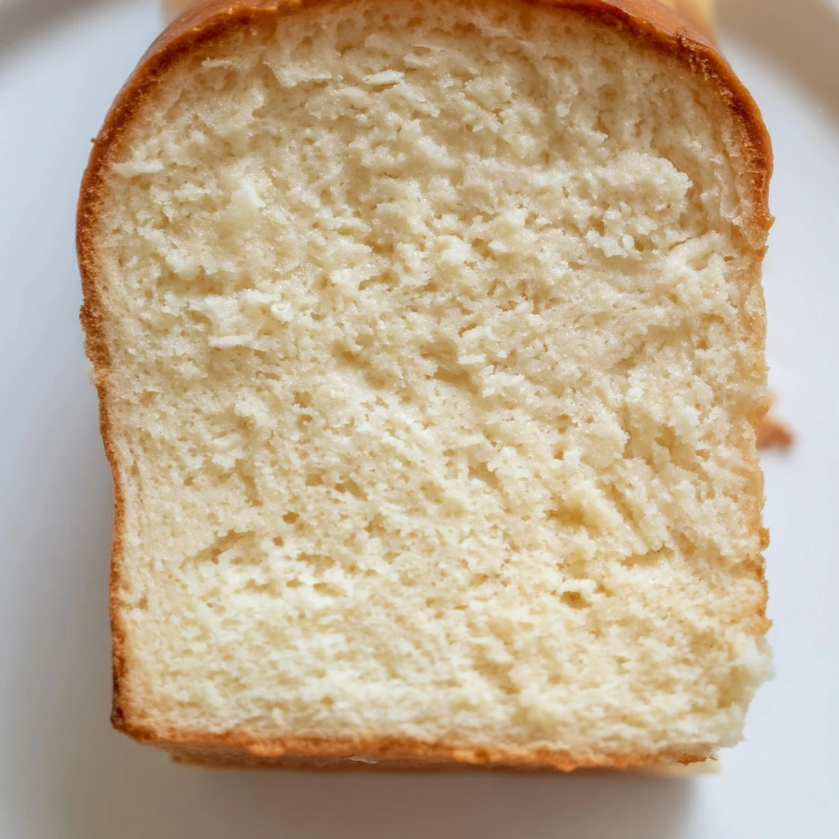 Protein-rich cottage cheese loaf bread cooling on a wire rack after baking to golden perfection