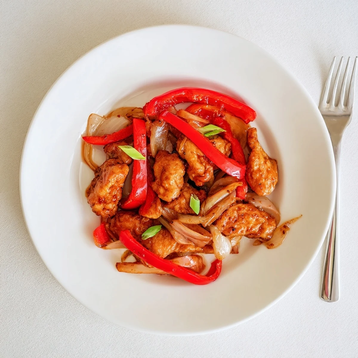 Golden crispy pepper chicken tossed with bell peppers and aromatic black pepper sauce