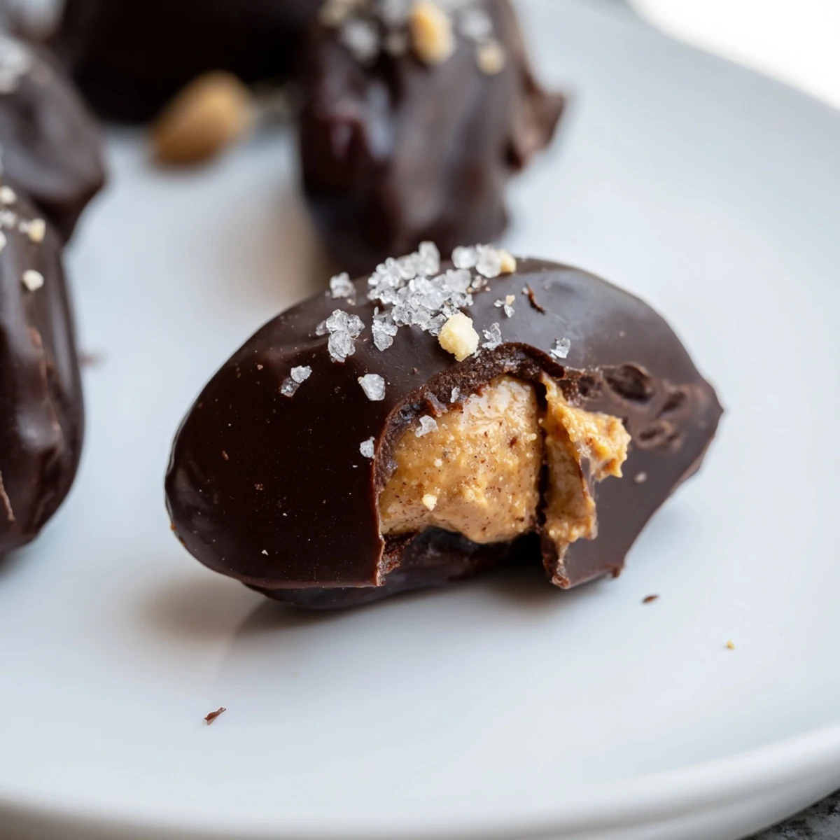 Healthier Date Snickers featuring sweet Medjool dates with creamy peanut butter filling