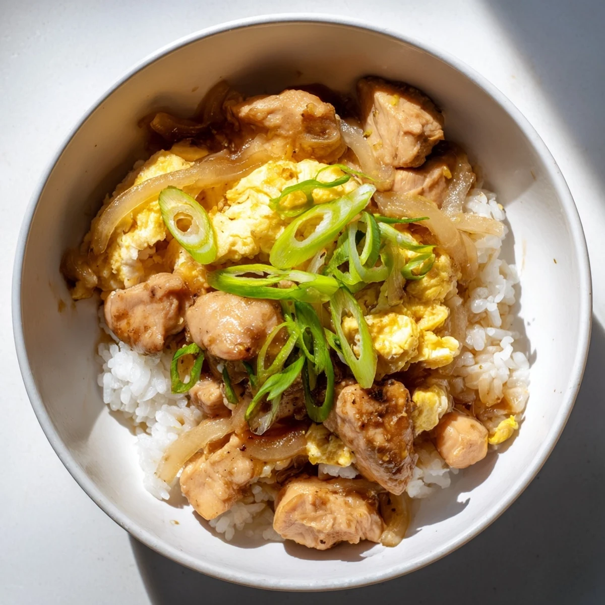 Golden One Pot Oyakodon bowl featuring fluffy rice topped with tender chicken and soft-set eggs