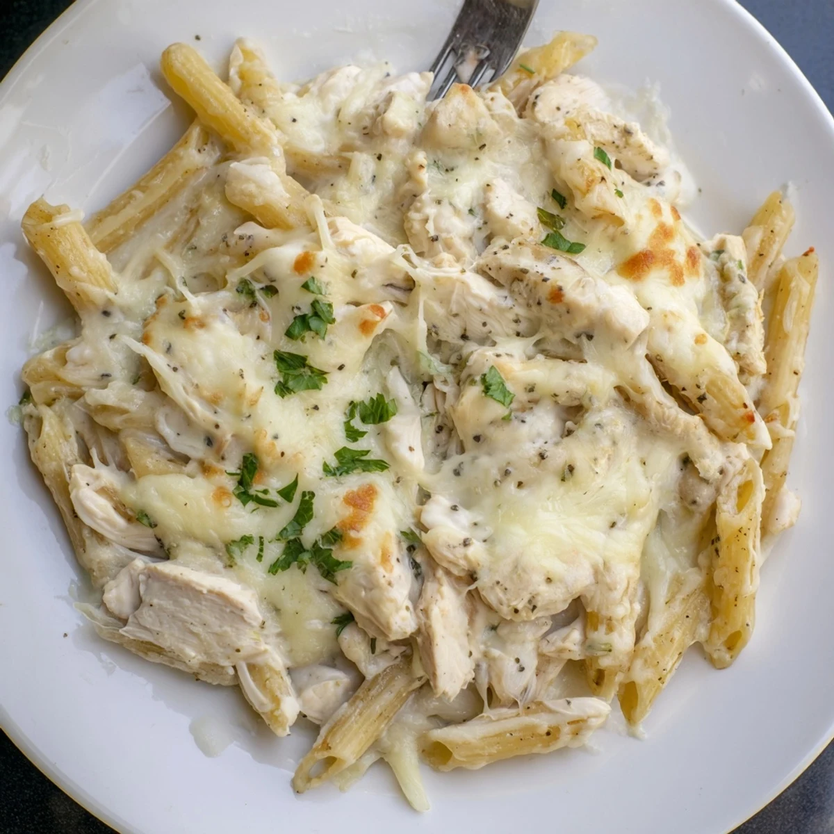 Baked Creamy Chicken Alfredo Bake With Mozzarella Crust, golden-bubbly top, paired with salad