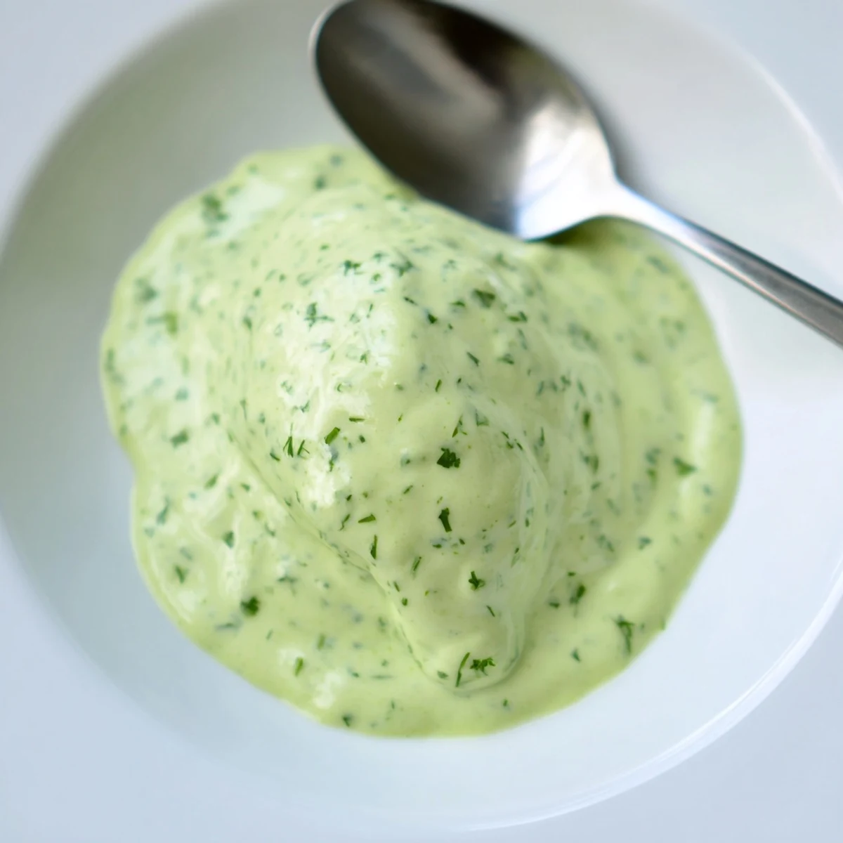 Creamy cilantro lime sauce drizzled generously over spicy grilled chicken tacos with fresh garnish